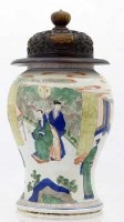 Lot 523 - Kangxi wucai baluster vase and carved wood cover.
