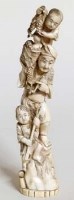 Lot 548 - Japanese walrus ivory okimono of a man with two