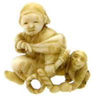 Lot 570 - Ivory figure with monkey.