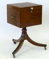 Lot 877 - Mahogany cellaret on tripod stand.