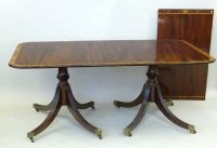 Lot 893 - Mahogany twin-pedestal extending dining table