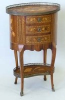 Lot 902 - A French kingwood marquetry oval table en chiffoniere