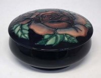 Lot 215 - Moorcroft lidded bowl   decorated with a single