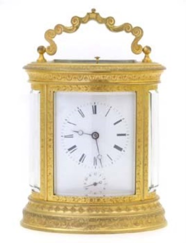 Lot 645 - French oval carraige clock alarm.