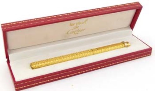 Lot 344 - Must de Cartier gold plated ball point pen in original case