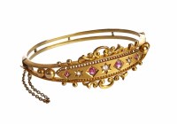 Lot 39 - Victorian diamond and ruby Etruscan style gold bangle