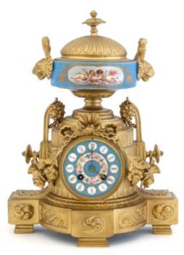 Lot 679 - Gilt mantel clock with porcelain panel