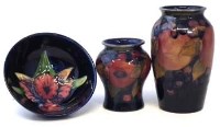 Lot 128 - Two Moorcroft pommegranate vases and an orchid