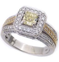 Lot 209 - 18k (750) fancy yellow diamond ring surrounded by
