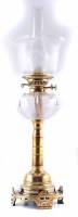 Lot 4 - A 19th century brass oil lamp with frosted, acid-etched shade and ridged cut glass oil well. 70 x 22 cm.
