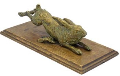 Lot 17 - Brass wall mounted hare.