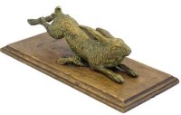 Lot 17 - Brass wall mounted hare.