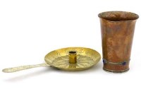 Lot 34 - Copper beaker and brass candlestick.