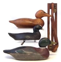 Lot 88 - Three wood decoys and a game rack
