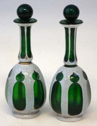 Lot 128 - Pair of green overlay bohemian bottles.