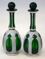 Lot 128 - Pair of green overlay bohemian bottles.