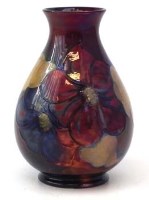 Lot 194 - Moorcroft flambe clematis pattern vase, circa