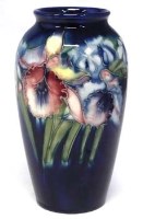 Lot 200 - Moorcroft vase decorated with Orchid pattern.