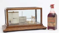 Lot 757 - Oak cased barograph by Dunscombe together with ink bottle and spare papers.