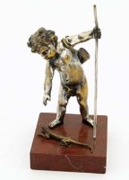 Lot 19 - Silver plated figure of a boy and lizard.