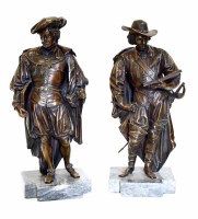 Lot 453 - A pair of bronze figures on marble bases.