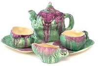 Lot 262 - Clarice Cliff 'Le Bon Dieu' shape tea for two set circa 1932, painted with a green and purple delecia glaze.