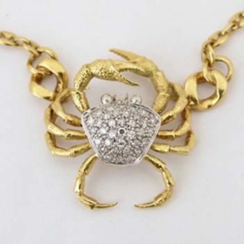 Lot 316 - Gold and diamond crab pendant.