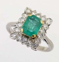 Lot 321 - 18ct white gold emerald and diamond ring in a