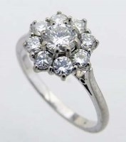Lot 332 - 18ct white gold diamond floret cluster ring.