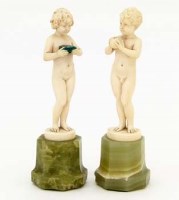 Lot 7 - Pair of ivory and onyx Preiss figures.