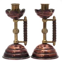 Lot 21 - Pair of Benam Froud candlesticks, the design attributed to Christopher Dresser