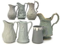 Lot 117 - Seven green stoneware jugs.