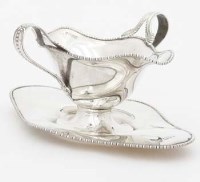 Lot 189 - Silver double ended sauce boat and stand.