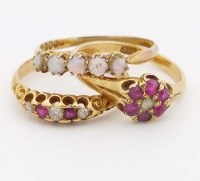 Lot 276 - Three gold ruby and opal rings (3).