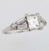 Lot 282 - Platinum and diamond ring, the step-cut central