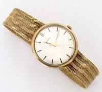 Lot 302 - Omega 9ct gold wrist watch on integral bracelet