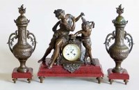 Lot 490 - French garniture de cheminee on red marble bases.