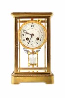 Lot 464 - A 19th century brass framed four glass mantel clock.
