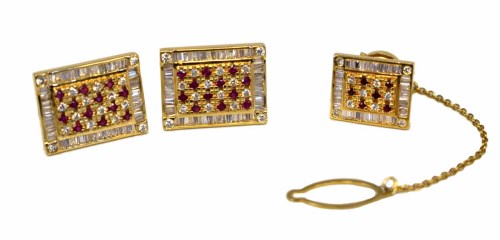 Lot 273 - An 18ct gold diamond and ruby set by Deakin & Francis