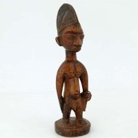 Lot 127 - Ijebu ibeji male figure, indigo head dress, metal