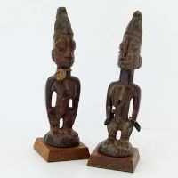Lot 133 - Pair of Yoruba ibeji female figures, traces of