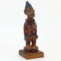 Lot 137 - Yoruba ibeji female figure, indigo and Rickets