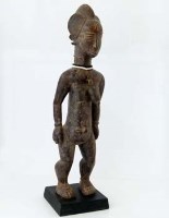 Lot 143 - Ebrie nkpasapi female standing figure, West