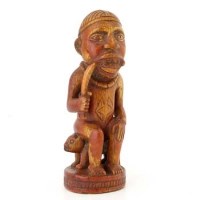 Lot 154 - Kongo ivory figure of a chieftain sitting on a