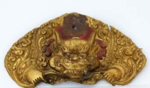 Lot 167 - Tibetan gilt copper temple door plate, 18th