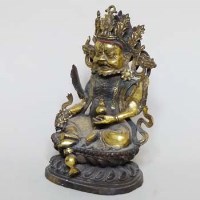 Lot 174 - Tibetan gilt bronze deity.