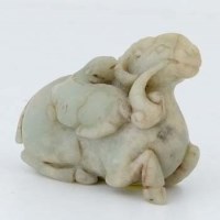 Lot 193 - Chinese pale green jade carving of a crouching