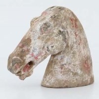 Lot 194 - Chinese grey pottery horse's head, Han dynasty