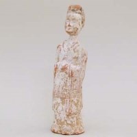 Lot 221 - Tang Dynasty figure of a female attendant.