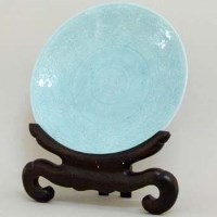 Lot 232 - Celadon plaque with stand.